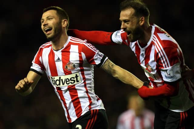 Scotland internationals Phil Bardsley, left, and Steven Fletcher celebrate. Picture: AP