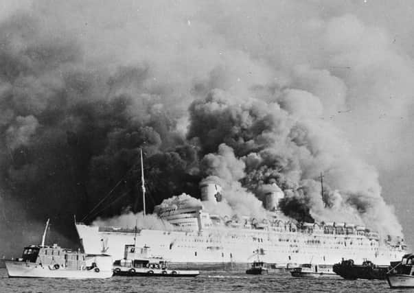 On this day in 1972, the Clyde-built Queen Elizabeth liner sank in Hong Kong harbour after being set alight by vandals. Picture: Getty