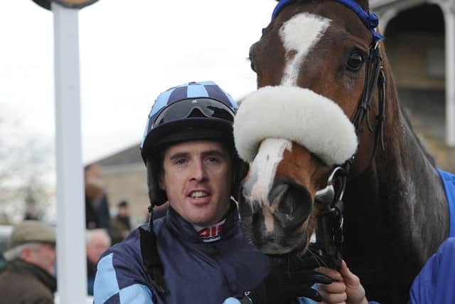 Jason Maguire celebrates his 100th winner of the season. Picture: PA