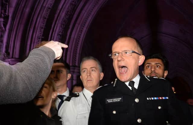 Met assistant commissioner Mark Rowley is drowned out by shouting. Picture: Getty