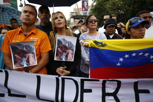 Supporters of the dead couple protested in Caracas. Picture: Reuters