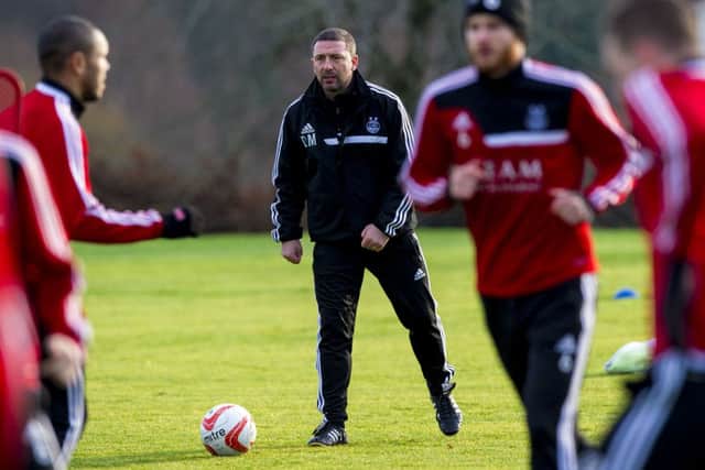 Aberdeen boss Derek McInnes (centre) gets involved at training. Picture: SNS