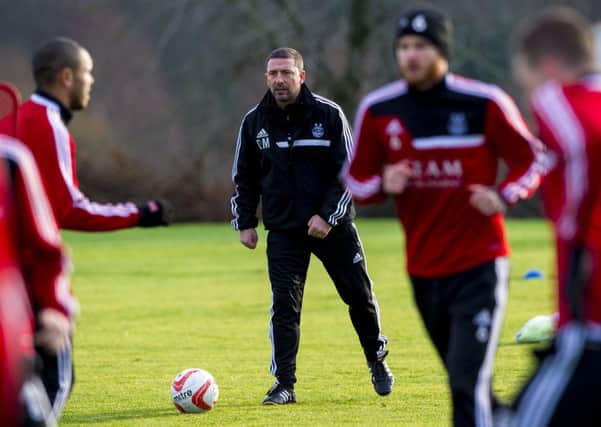 Aberdeen boss Derek McInnes (centre) gets involved at training. Picture: SNS