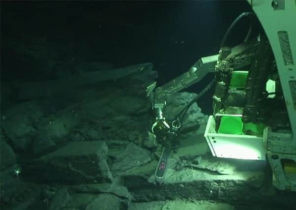 The basalt rock column is explored by the remotely operated vehicle. Picture: Complimentary