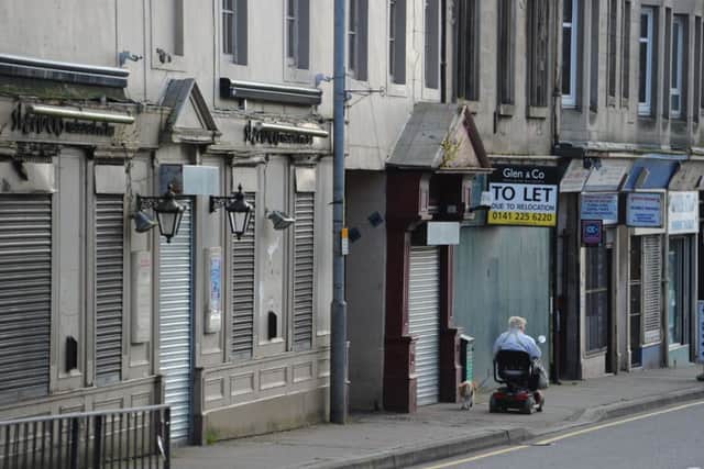 Boarded-up shops on Wishaw High Street. Picture: Robert Perry