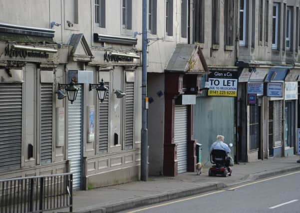 Boarded-up shops on Wishaw High Street. Picture: Robert Perry