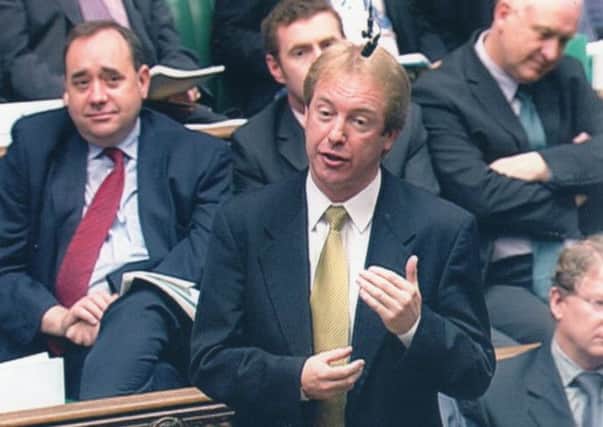 John Barrett during his days as an MP, with Alex Salmond sitting behind him. Picture: Contributed