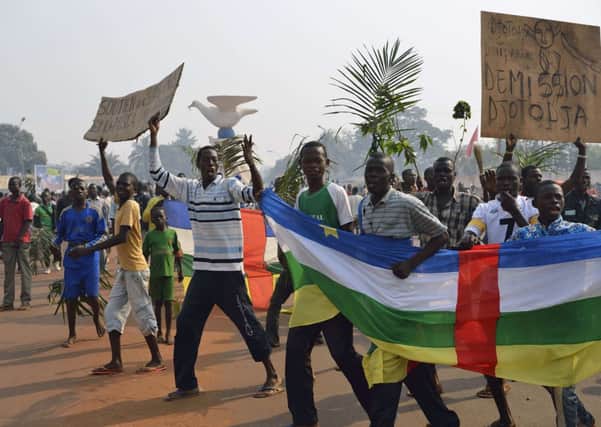 Anti Seleka demonstrators holding a placard reading "Djotodia Resign" march through Bangui, CAR. Picture: Getty