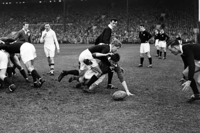 Foot-rush proponent Jim Greenwood tackles an Irish player during a 1959 clash. Picture: TSPL