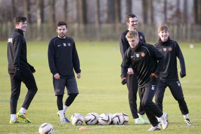 John Souttar, Ryan Dow, Gavin Gunning and Ryan Gauld are all smiles as they watch Stuart Armstrong in training. Picture: SNS