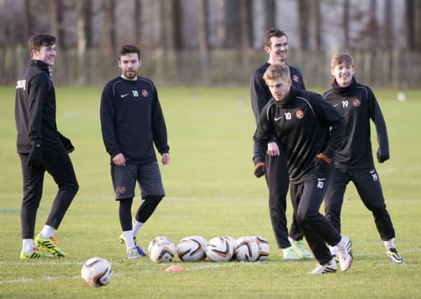 John Souttar, Ryan Dow, Gavin Gunning and Ryan Gauld are all smiles as they watch Stuart Armstrong in training. Picture: SNS
