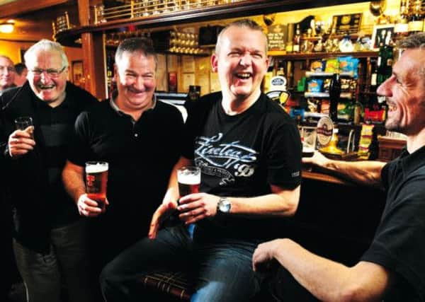 Customers enjoying a pint and the banter in the bar of the Black Bull, Mid Calder. Picture: Ian Rutherford