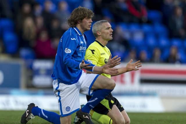 Goalscorer Murray Davidson and St Mirren's Jim Goodwin appeal to the referee after an incident. Picture: SNS