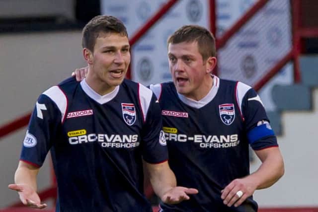 Filip Kiss, left, is congratulated by Richie Brittain after scoring twice on his debut to earn Ross County a point at Firhill. Picture: SNS