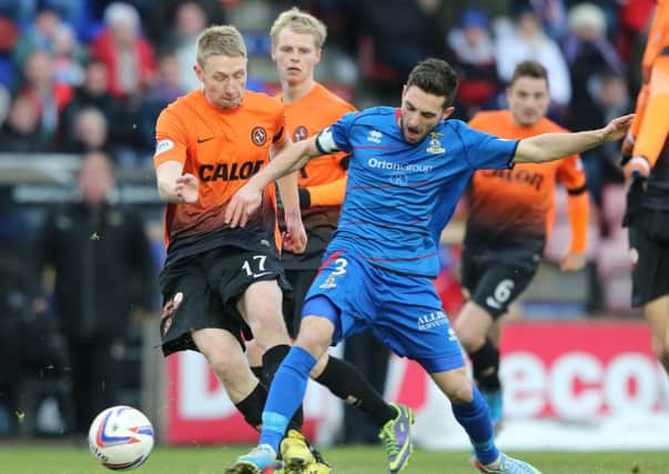 Inverness Caledonian Thistle's Graeme Shinnie takes on Dundee United's Chris Erskine. Picture: PA