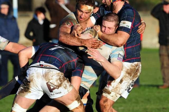 Accies outside centre Ewen Campbell is held by Chevvy Pennycook. Picture: Ian Rutherford