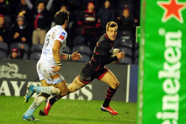 Tom Brown leaves James Hook trailing as he  crosses for Edinburghs first try. Picture: Ian Rutherford