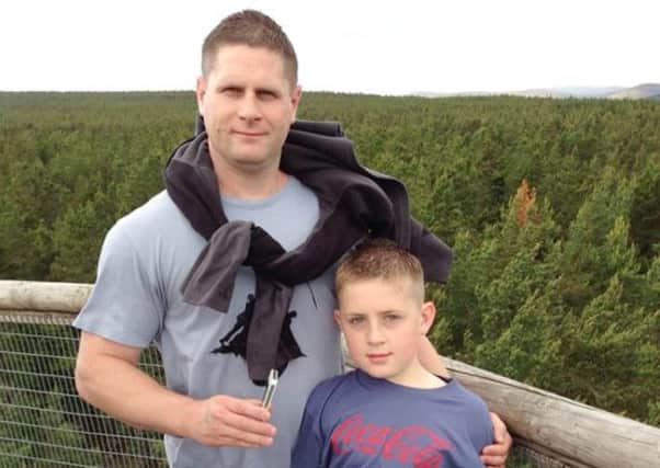 Christopher Groves, 38 and his son Connor, nine. Picture: PA