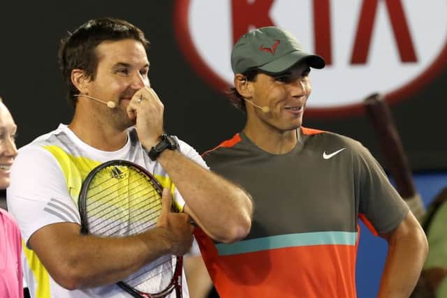 Pat Rafter and Rafa Nadal share a joke during an exhibition match at the weekend. Picture: AP