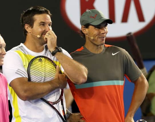 Pat Rafter and Rafa Nadal share a joke during an exhibition match at the weekend. Picture: AP