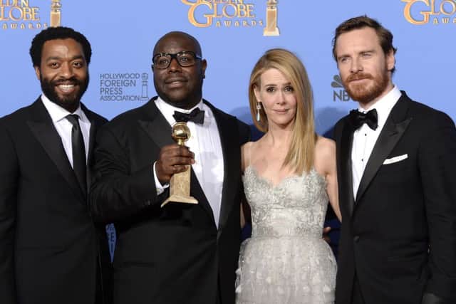 Chiwetel Ejiofor (L), Steve McQueen, Sarah Paulson and Michael Fassbender with the Golden Globe. Picture: Getty