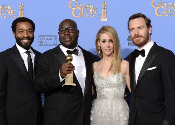 Chiwetel Ejiofor (L), Steve McQueen, Sarah Paulson and Michael Fassbender with the Golden Globe. Picture: Getty
