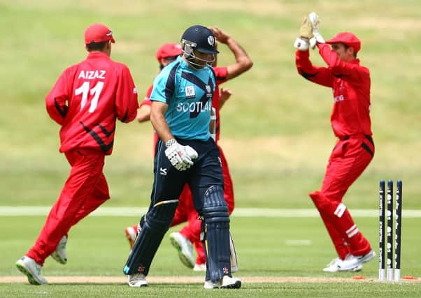 Hong Kong celebrate after their 17-run win over Scotland in Queensland. Picture: Getty