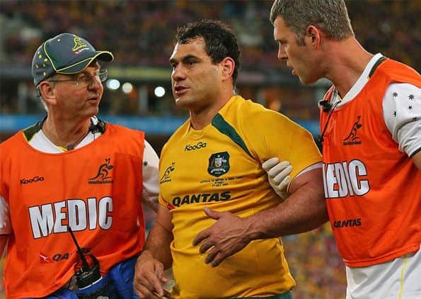Australia flanker George Smith is helped from the field after suffering concussion in a clash of heads. Picture: Getty