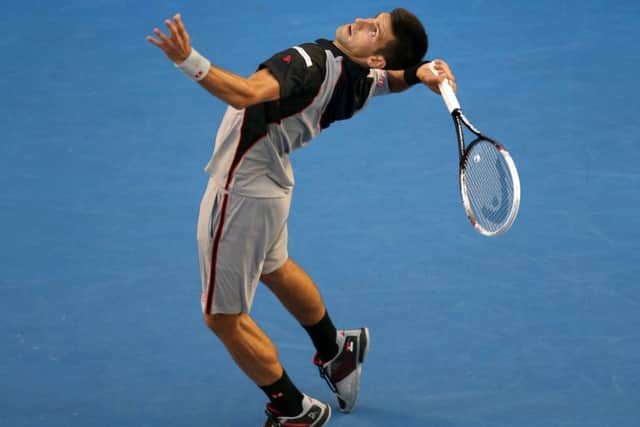 World No 2 Novak Djokovic serves to Lukas Lacko. Picture: Getty