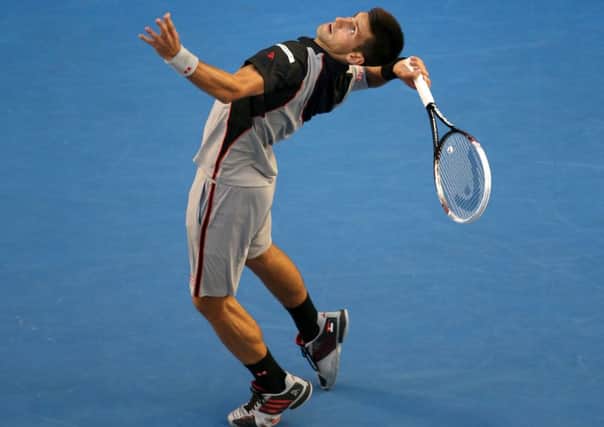 World No 2 Novak Djokovic serves to Lukas Lacko. Picture: Getty
