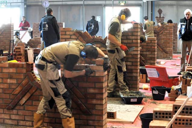 Teaching construction skills to young people is proving a major success. Picture: AFP/Getty