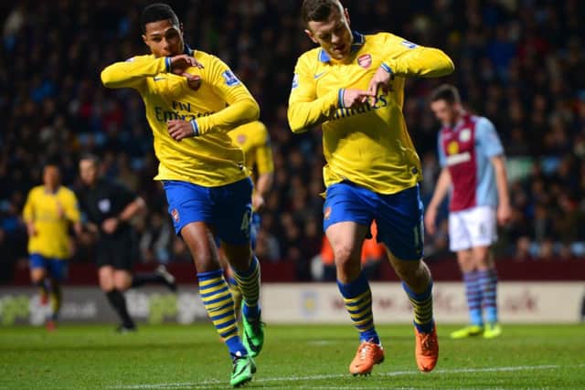 Arsenals Jack Wilshere signs the letter A with his fingers after scoring the opener. Picture: Getty