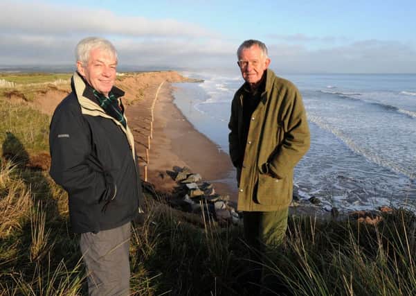 David May and Montrose Golf Links chairman Alan Crow at the spot where storms eroded part of the course. Picture: Hemedia