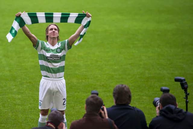 New signing Stefan Johansen tries a Celtic shirt for size at Parkhead yesterday. Picture: SNS