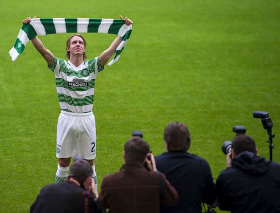 New signing Stefan Johansen tries a Celtic shirt for size at Parkhead yesterday. Picture: SNS