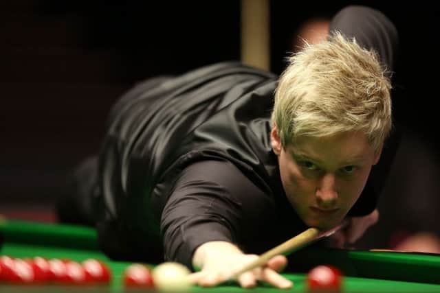 Neil Robertson survived a huge kick in the final frame to secure victory. Picture: PA