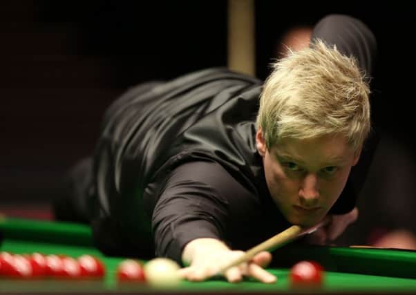 Neil Robertson survived a huge kick in the final frame to secure victory. Picture: PA