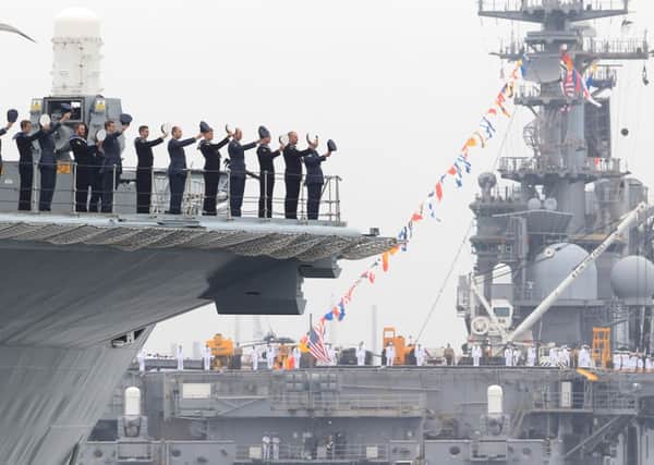 Britain, now without the Ark Royal, left, has no carriers like the USS Wasp.  Picture: Getty Images
