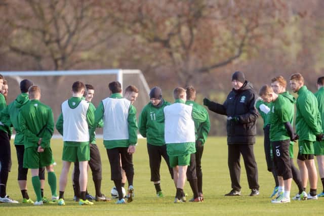 Hibernian manager Terry Butcher directs his players at a training session yesterday. Picture: Phil Wilkinson