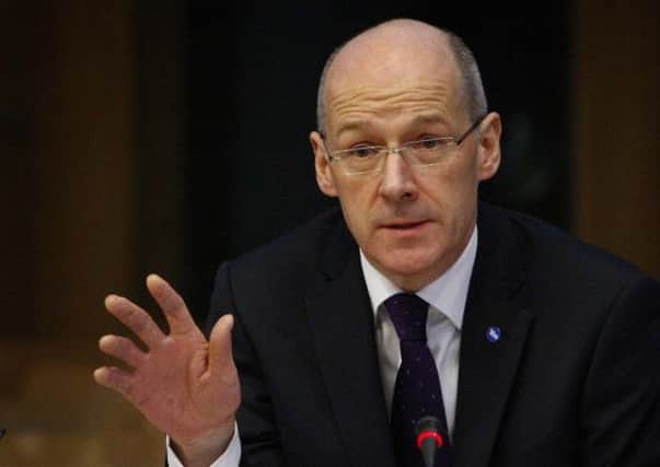 John Swinney: Budget demonstrates 'benefits of decisions being made in Scotland'. Picture: PA