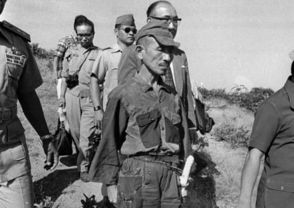 Hiroo Onoda, wearing his 30-year-old imperial army uniform, cap and sword, in March 1974. Picture: AP