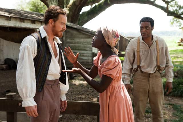Lupita Nyongo with co-stars Michael Fassbender and Chiwetel Ejiofor in 12 Years A Slave. Picture: AP