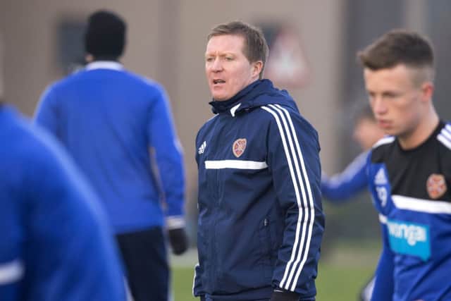 Gary Locke supervises his first-team squad as they trained at Riccarton yesterday. Picture: SNS