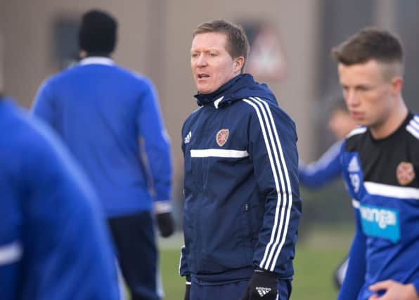 Gary Locke supervises his first-team squad as they trained at Riccarton yesterday. Picture: SNS