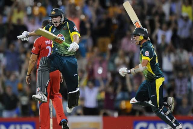 James Faulkner, left, and Clint McKay of Australia celebrate their dramatic onewicket win. Picture: Getty
