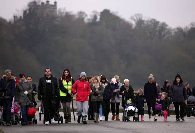 Mothers and their children line up to scour the promenade as part of the search. Picture: PA