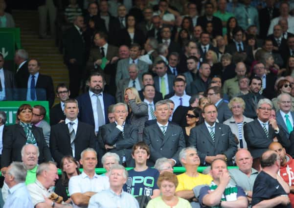 Celtic chief executive Peter Lawwell, centre, has been driving proposals to introduce safe standing areas to Parkhead. Picture: Robert Perry