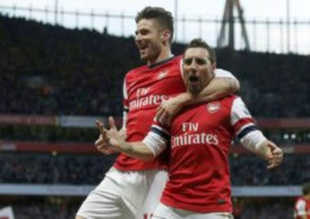 Arsenals Santi Cazorla, right, celebrates with Olivier Giroud. Picture: AFP/Getty