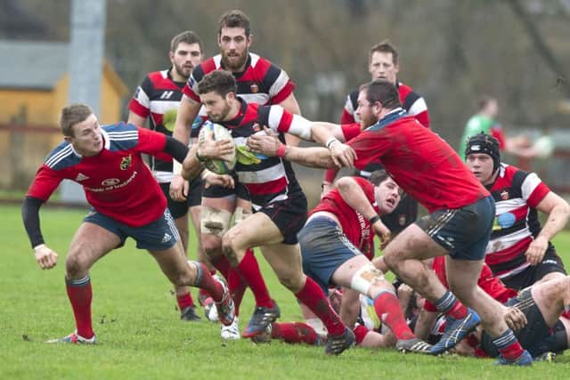 Stirling centre Sean Kennedy breaks away as County try to break the Munster stranglehold. Picture: SNS/SRU