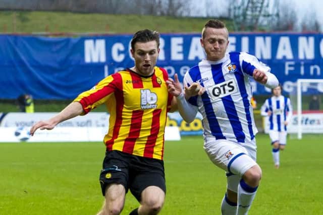 Partick's Stephen O'Donnell (left) and Sammy Clingan battle for possession. Picture: SNS